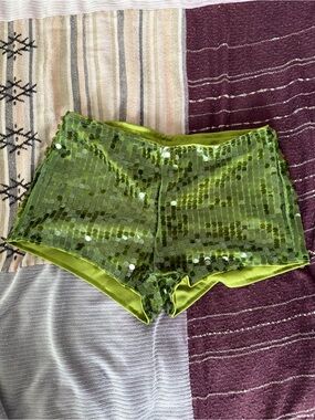 Green sequin mini shorts